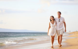 Couple Walking On Beach